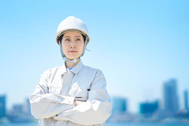 istock A woman wearing a helmet and wearing work clothes 1498174850