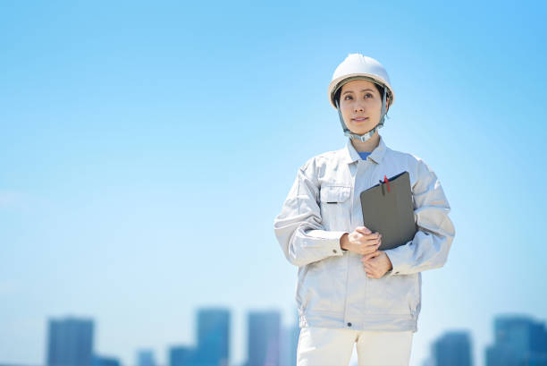 istock A woman wearing a helmet and wearing work clothes 1498174963