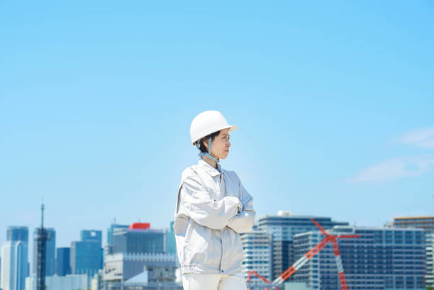 istock A woman wearing a helmet and wearing work clothes 1498175078