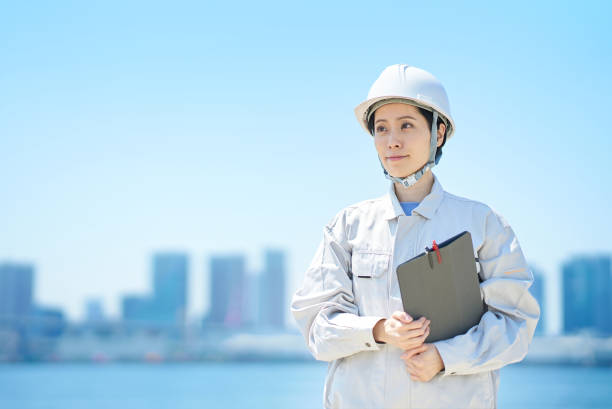 istock A woman wearing a helmet and wearing work clothes 1498175152