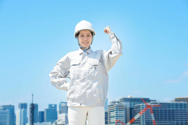 istock A woman in work clothes doing a positive pose 1498177930