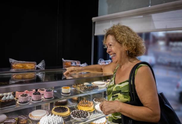 istock Senior woman at a bakery store 1498178768