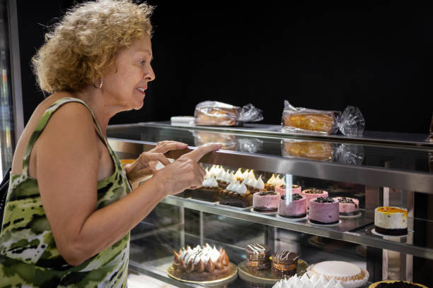 istock Senior woman at a bakery store 1498178789