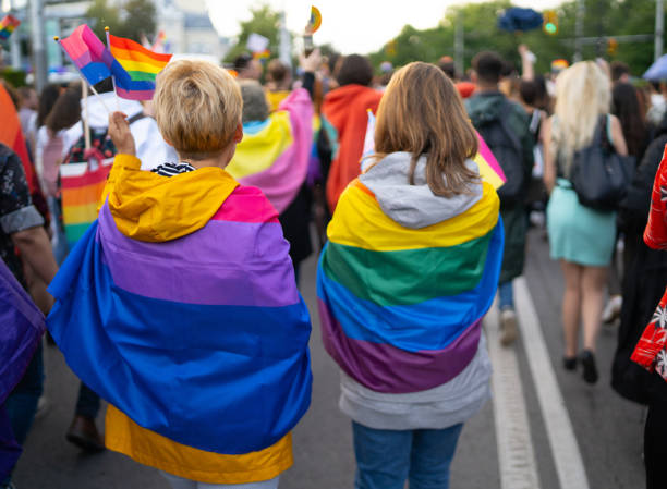 istock LGBT women wearing flags during pride event 1498178852