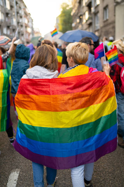 istock Lesbian women wearing flags during pride event 1498178855