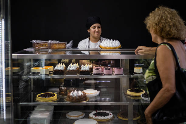 istock Senior woman at a bakery store 1498178874