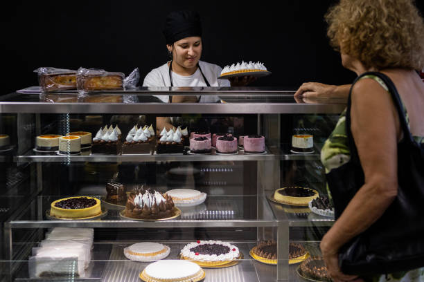 istock Senior woman at a bakery store 1498178906