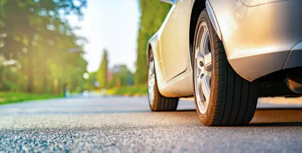 Photo of Car is on the roadside of the country road