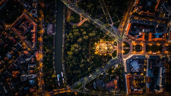 An aerial view of downtown Berlin, illuminated by the lights of buildings and traffic at night