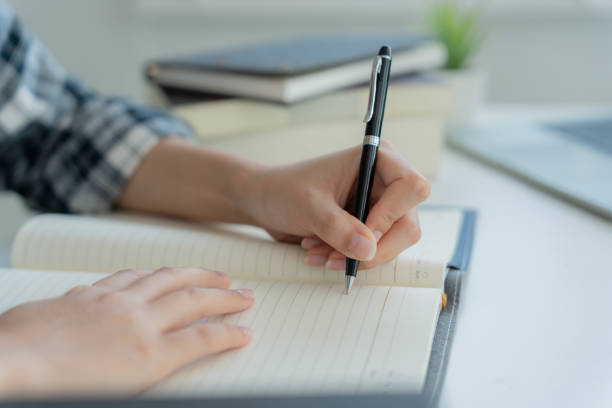 istock Student, use left-handed, inspiration, writer, writing ,creative ,recreation for imagine, writing ideas on notebook, to do list, good thinking work, journalist, Stylish, Dream image, relax, designer 1498181306