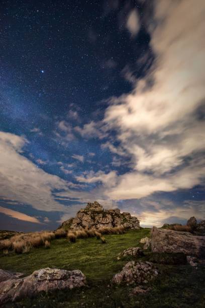 istock Stunning nighttime view featuring a vast stretch of dark sky filled with beautiful white clouds 1498181485