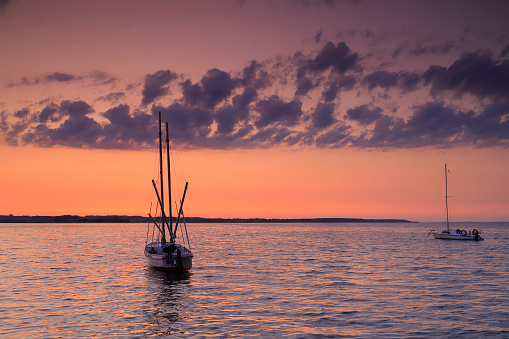 Sailing boat at sunset in Rewa - Poland