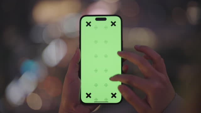Green screen template smartphone in hands