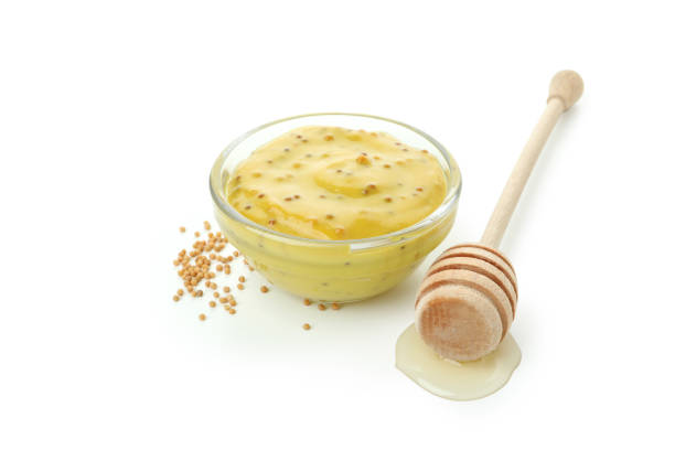 istock Mustard honey sauce isolated on white background 1498188569