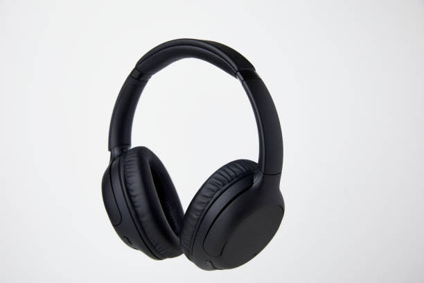 istock Black Wireless Headphones Floating in Studio - Stock Photos. 1498194898
