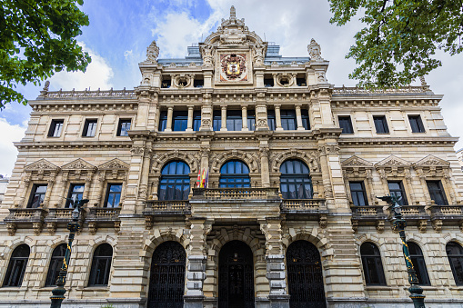 Biscay Foral Delegation Palace with neoclassical design and a symmetrical facade adorned with ornate columns and a prominent central entrance. Bilbao, Basque Country, Spain.