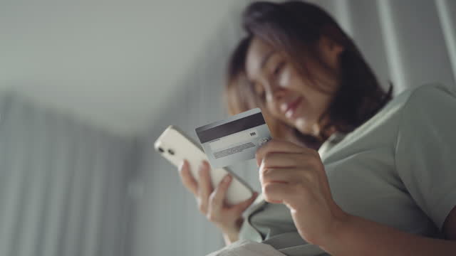 Woman paying with Credit card