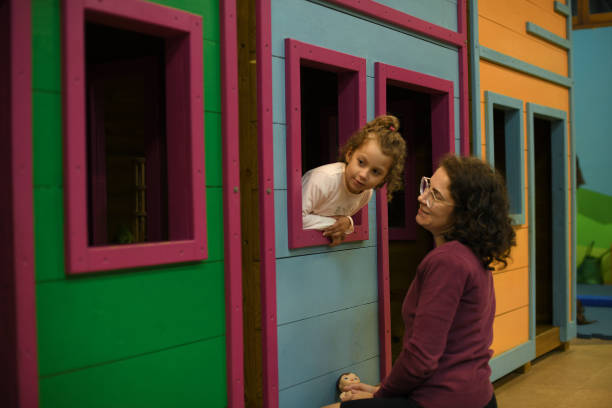 istock Mother is playing with her daughter on the playground. 1498198847