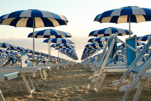 istock Blue and white beach umbrellas 1498199786