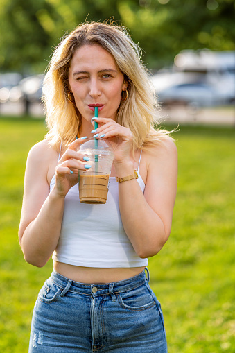 Woman holding her iced coffee