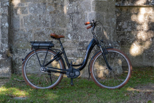 istock Retro bicycle by and old church 1498199847