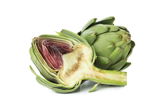 Close-up on a stack of artichokes on a market stall.