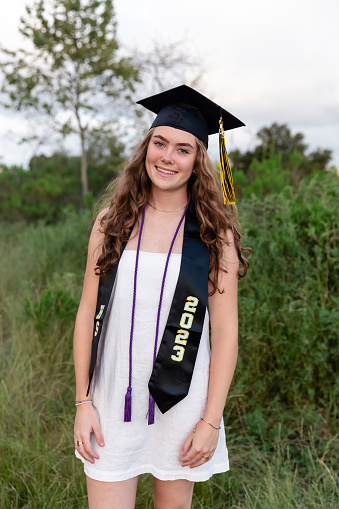 Teenage girl in a graduation cap