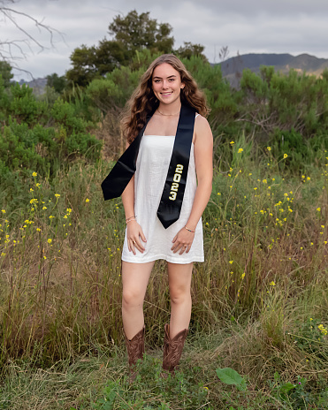 Teenage girl in a graduation cap