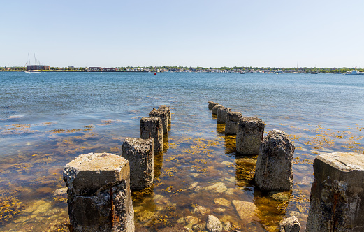 Old pier pilings in Narraganset bay near Fort Adams State Park, Rhode Island