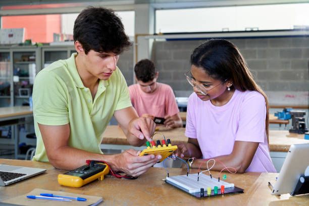 istock Multiracial students in electronic class learning together and helping each other. 1498217940