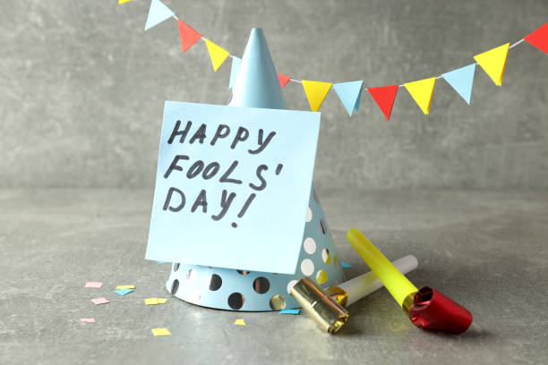 istock Concept of April Fool's Day on gray textured table 1498218598