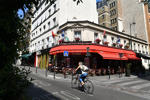 Paris, France - April 30, 2017: People eating outside in Paris cafe, France