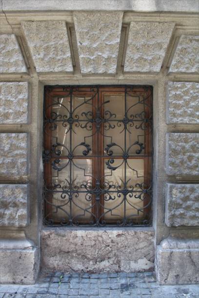 istock an iron window frame on an old building with a brick wall 1498221308