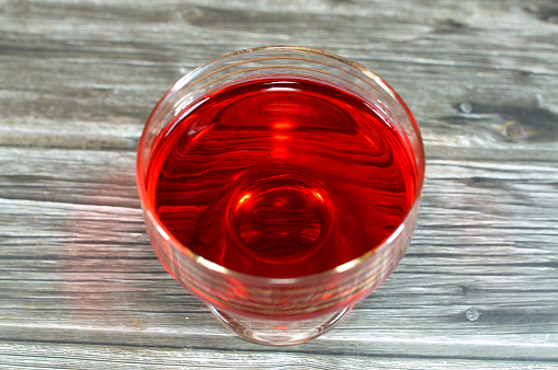 A close up of a delicious sweet red jelly pudding strawberry flavored, selective focus of chilled red strawberry jelly dessert, Gelatin desserts (also Jelly or Jello), a sweetened and flavoured, selective focus