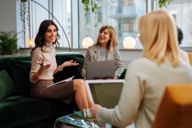 istock Office staff casual meeting in lounge. 1498226253