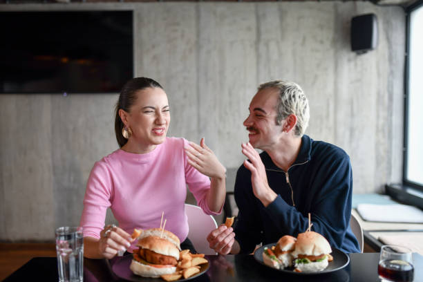 istock Hot Burger Dinner For Cute Couple 1498226493