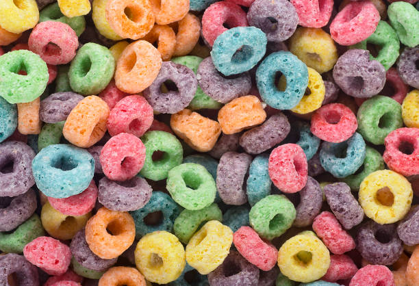 istock Delicious and nutritious fruit cereal rings as background, top view. Healthy breakfast. 1498226527