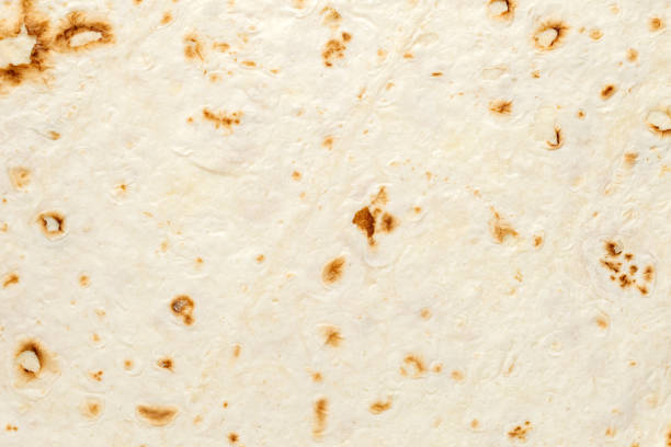 istock Pita tortilla, baked surface close-up, uniform texture background 1498231314