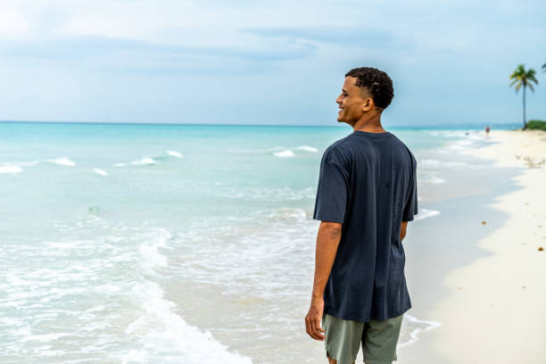 Young man taking a look of the ocean