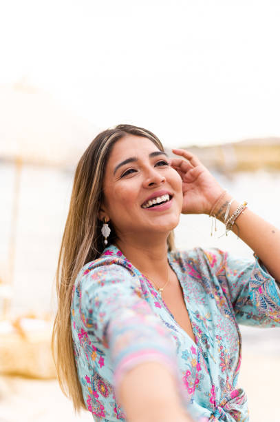 istock Happy woman taking a selfie on the seafront 1498233424