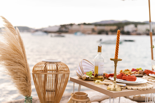 Photo with copy space of an elegant table with healthy food next to the sea