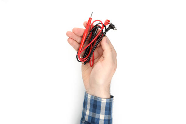 istock Male hand holds multimeter components, isolated on white background 1498233933