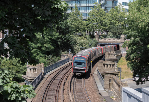 istock Train (Hamburg Rapid Transit System) passing bridge and enters the tunnel 1498236872