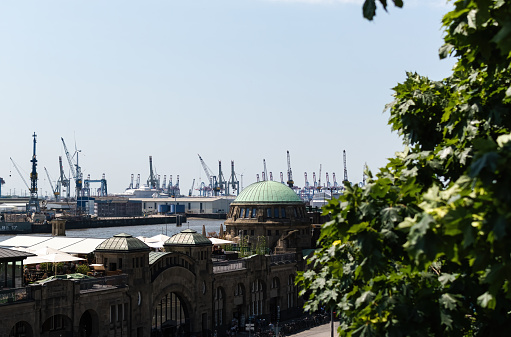 Amsterdam, Netherlands - June 28, 2018: Commercial ships docked along the River Ij in Amsterdam