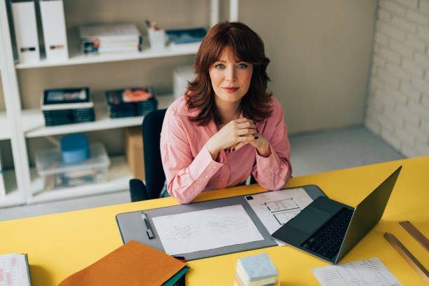 istock Beautiful Woman Architect Working on her Project in the Office 1498243513