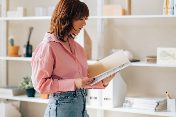 istock Beautiful Young Female Architect Working on her Project 1498243526