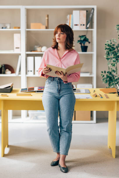 istock Beautiful Young Female Architect Working on her Project 1498243533