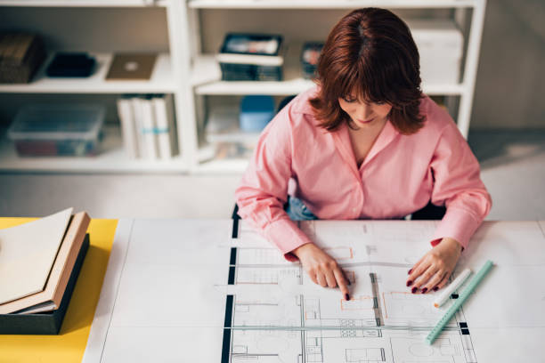 istock Happy Woman Architect Working on her Project in the Office 1498243538