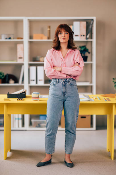 istock Confident Female Entrepreneur Standing in her Office 1498243557