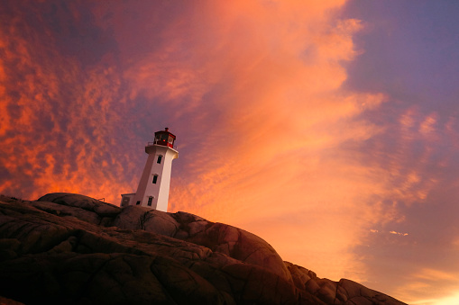 Lighthouse at night with spotlight beam . This is a 3d render illustration.